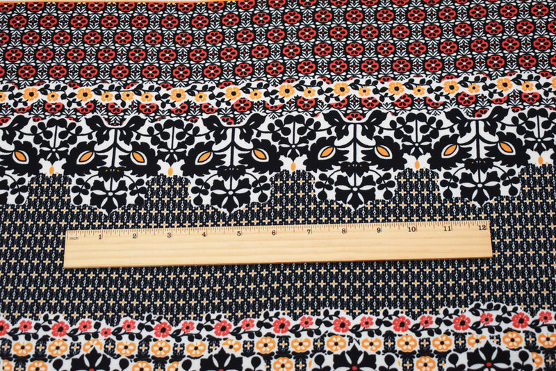 Black-Orange-Multi Poly Floral Border Printed Pebble Crepe Woven Fabric
